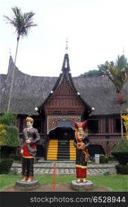 Sculptures near facade of palace in Bukittingi, Indonesia