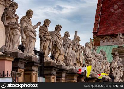 Sculptures on the facade of the Church of Saints Peter and Paul. Krakow. Poland.. Krakow. Church of Saints Peter and Paul.