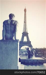 Sculptures on Trocadero and Eiffel Tower in Paris, France. Retro style filtered image