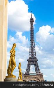 Sculptures on Trocadero and Eiffel Tower in Paris in summer day