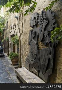 Sculptures on wall, Orvieto, Terni Province, Umbria, Italy