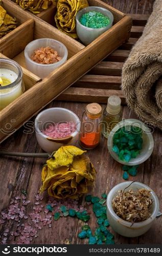 sea aromatic salt for Spa treatments on the background of yellow rose buds