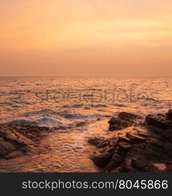 Sea at sunset Romantic Sea coast with waves crashing into the shore.