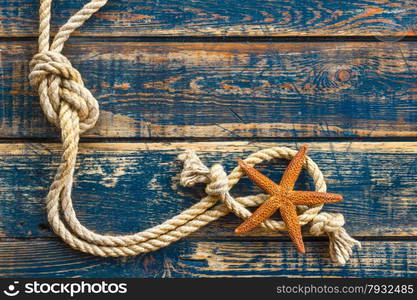 Sea background with starfish and marine rope