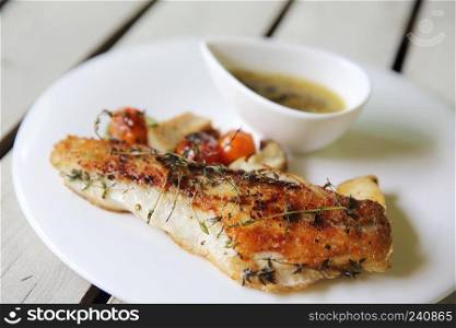 Sea bass fillet on wood background 