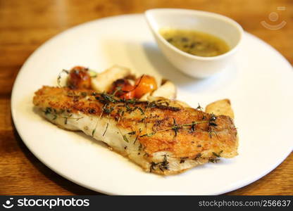 Sea bass fillet on wood background