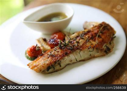 Sea bass fillet on wood background