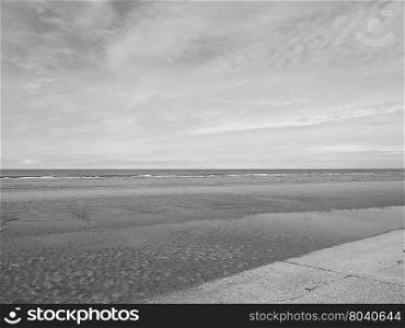 Sea beach shore. Empty sea seen from the beach useful as a background in black and white