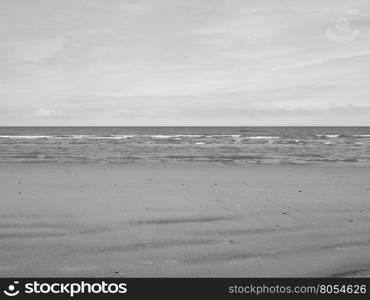 Sea beach shore. Empty sea seen from the beach useful as a background in black and white