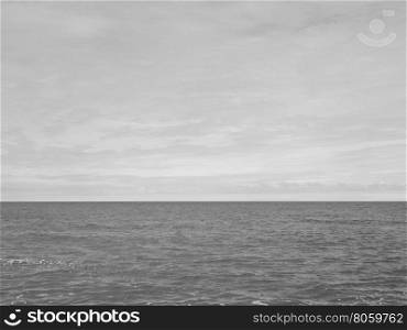 Sea beach shore. Empty sea seen from the beach useful as a background in black and white
