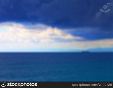 Sea blurred background of whirlwind over the sea, with ships at the horizon, horizontal image