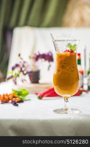 Sea buckthorn smoothie. Sea buckthorn smoothie on a white table background