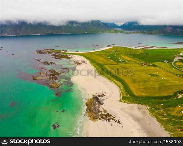 Sea coast and Skagsanden Beach on Flakstadoy in summer. Nordland county, Lofoten archipelago Norway. Tourist attraction.. Skagsanden Beach on Flakstadoy island, Lofoten Norway