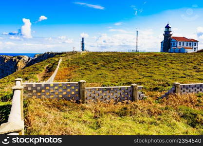 Sea coast landscape with fog horns and lighthouse on Cabo Penas in north Spain, Bay of Biscay, Asturias coastline. Tourist attraction.. Coast Cabo de Penas in Asturias, Spain