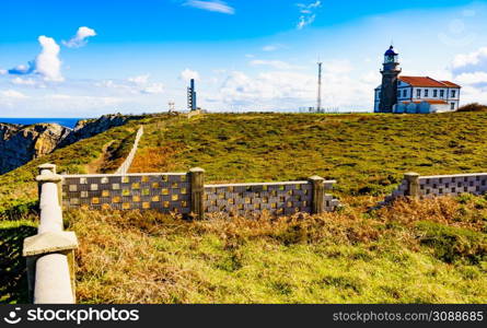 Sea coast landscape with fog horns and lighthouse on Cabo Penas in north Spain, Bay of Biscay, Asturias coastline. Tourist attraction.. Coast Cabo de Penas in Asturias, Spain
