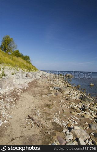 Sea coast. stones lie on sand