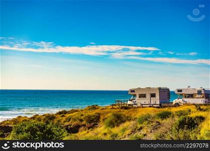 Sea coast view with camper car rv camping on beach. Spain Murcia region, Calblanque Regional Park.. Camper rv camping on sea shore, Spain