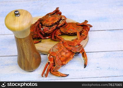 Sea crabs for cooking on wooden table in the kitchen&#xA;