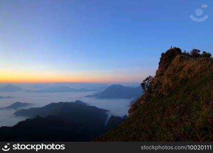 sea fog on the mountain hills with beautiful sky background