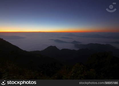 sea fog on the mountain hills with beautiful sky background