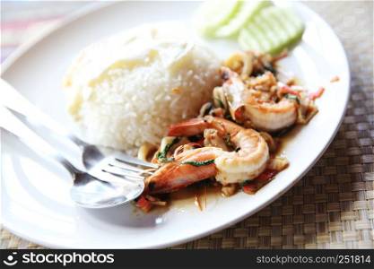 Sea food with basil and egg served with rice