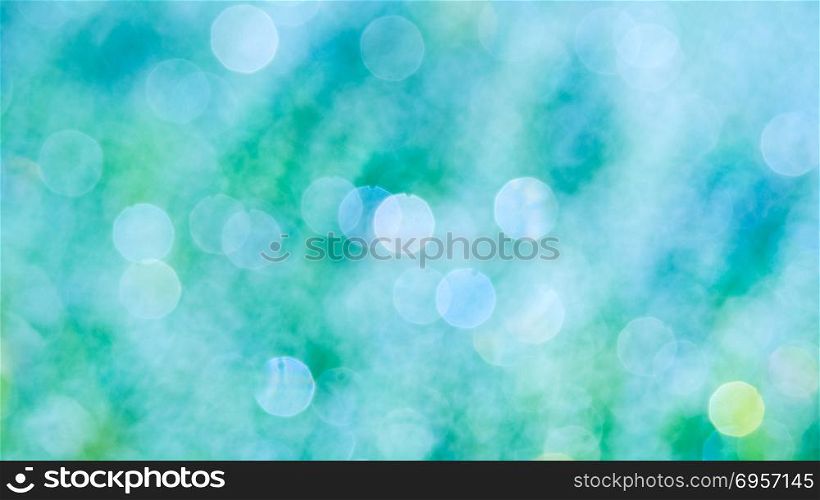 Sea green bokeh defocused background. Blue bokeh blurred texture.. Sea green bokeh defocused background