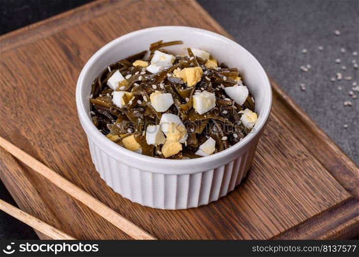 Sea kale seaweed salad Menu concept healthy eating. food background top view. Far Eastern salad - sea kale with egg in a white cup top