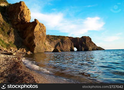 Sea landscape with grotto in the rock