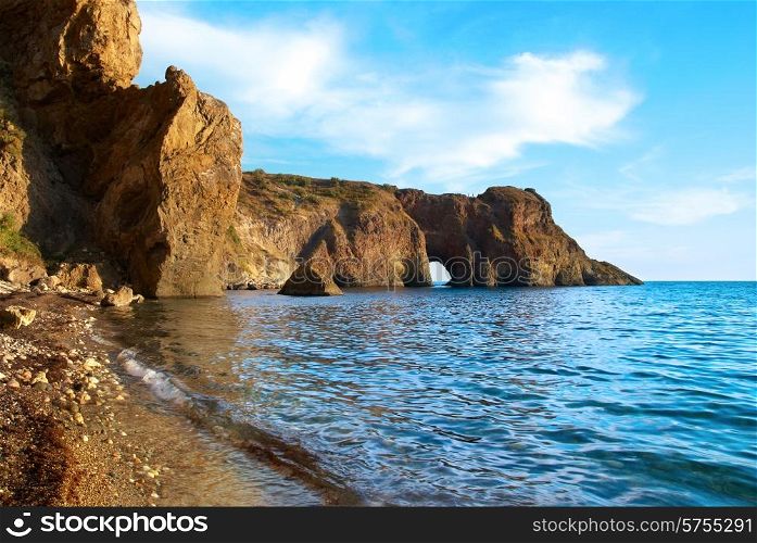 Sea landscape with grotto in the rock