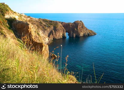 Sea landscape with grotto in the rock