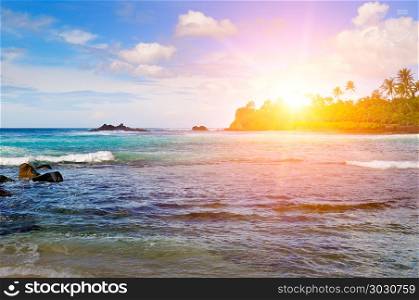 Sea landscape with rocky island and the sunrise. Beach.. Sea landscape with rocky island and the sunrise. Beach. Sri Lanka.