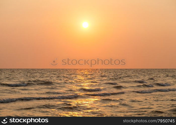 sea on the evening. The sun is about to fall in the evening.