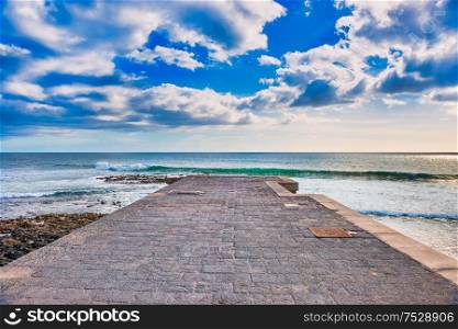 Sea pier landscape with blue sea and clouds