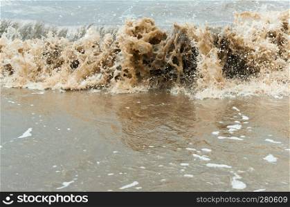 sea pollution, dirty yellow waves of the sea, the water is cloudy. dirty yellow waves of the sea, the water is cloudy, sea pollution