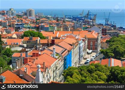 Sea port with cranes view and cityscape from Monastery roof in Lisbon, Portugal.