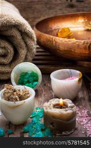 sea salt and accessories for a rejuvenating Spa sessions. bronze bowl with water and accessories spa treatments