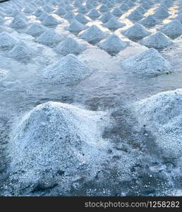 Sea salt farm at Samut Sakhon, Thailand. Organic sea salt. Evaporation and crystallization of sea water. Raw material of salt industrial. Sodium Chloride. Solar evaporation system. Iodine source.