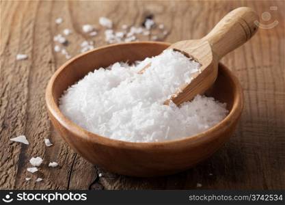 sea salt in wooden bowl and scoop