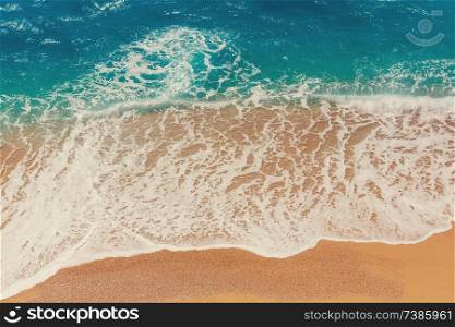 Sea sandy beach and  wave of blue ocean. Natural holiday background.