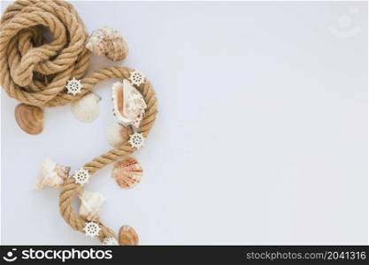 sea shells with nautical rope white table