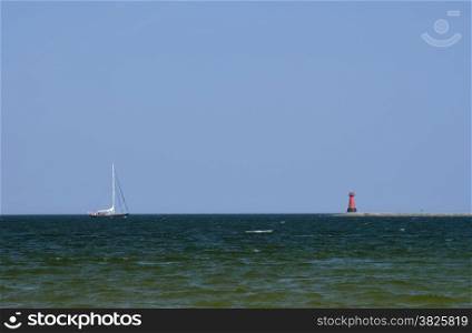 Sea, sky, yacht and lighthouse. Baltic sea. Poland. Danzig - Gda?sk