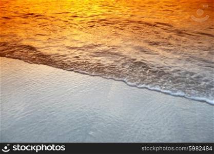 Sea sunset. Beautiful surf wave with reflection of beautiful sunset sky