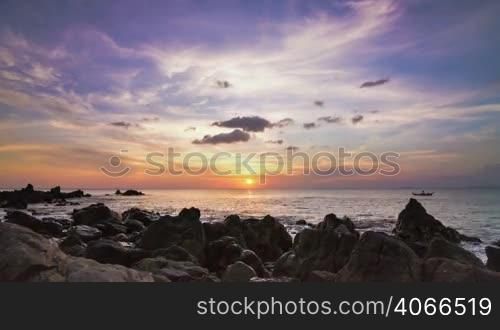 Sea sunset on rock shore slide panoram time lapse
