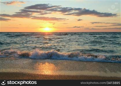 Sea sunset surf great wave break on sandy coastline