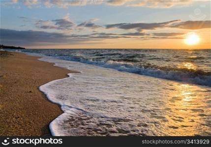 Sea sunset surf great wave break on sandy coastline