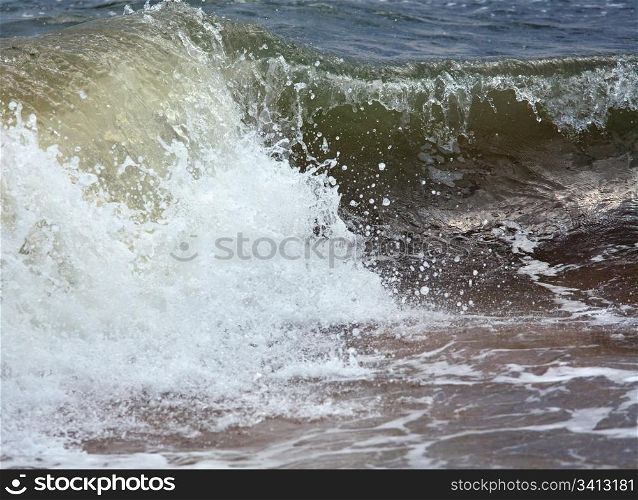 Sea surf great wave break on coastline (nature background)