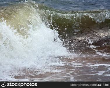 Sea surf great wave break on coastline (nature background)
