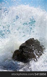 Sea surf wave closeup break on stone (Crimea, Ukraine)