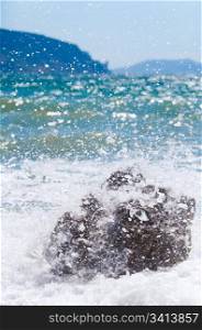 Sea surf wave closeup break on stone (Crimea, Ukraine)