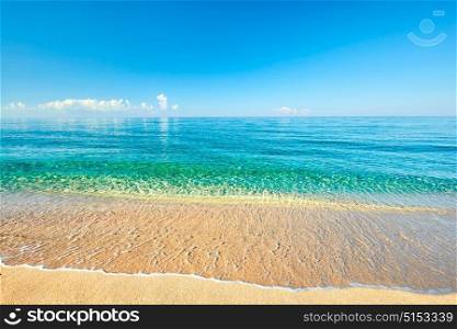 Sea view from tropical beach with sunny sky. Summer paradise beach. Tropical shore. Tropical sea. Exotic summer beach with clouds on horizon. Ocean beach relax, outdoor travel